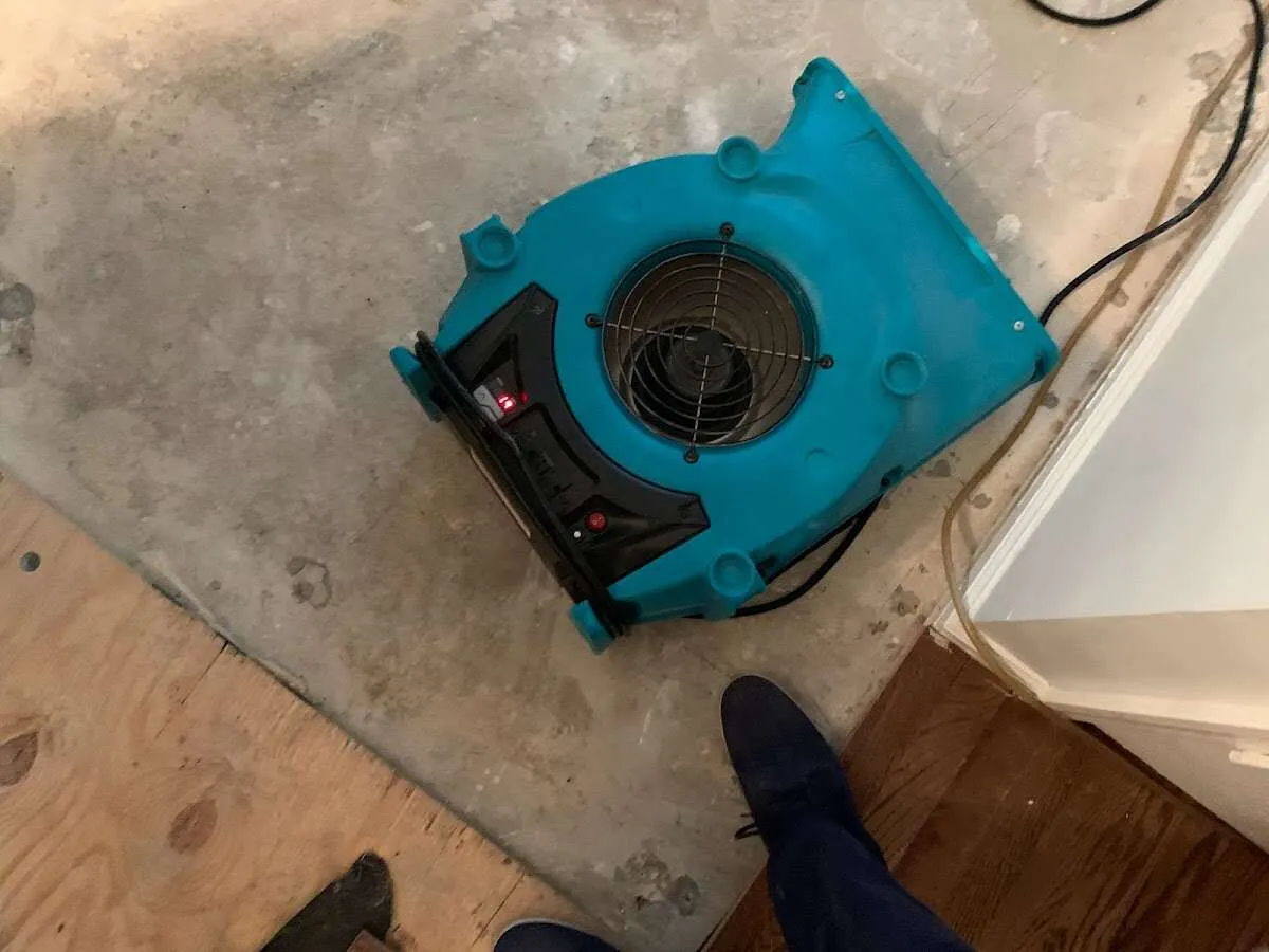 Air mover drying subfloor during Commercial Water Damage Restoration in Balch Springs
